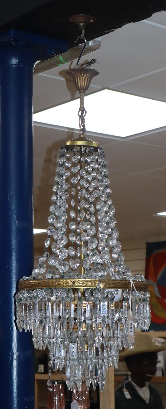 A gilt metal and cut glass bag shaped ceiling light